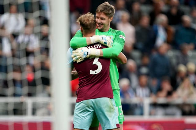 Wayne Hennessey and Charlie Taylor celebrate Burnley’s victory (Owen Humphreys/PA)