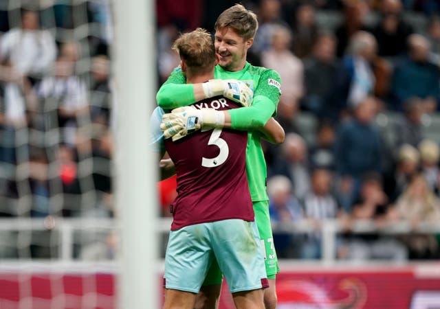 Wayne Hennessey and Charlie Taylor celebrate Burnley’s victory (Owen Humphreys/PA)