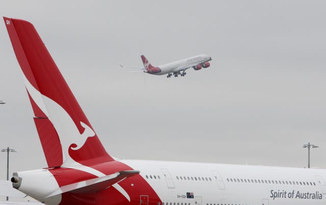 Qantas plans to resume flights between Australian and the UK – and other high-vaccination countries – in December (Steve Parsons/PA)