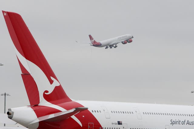 Qantas plans to resume flights between Australian and the UK – and other high-vaccination countries – in December (Steve Parsons/PA)