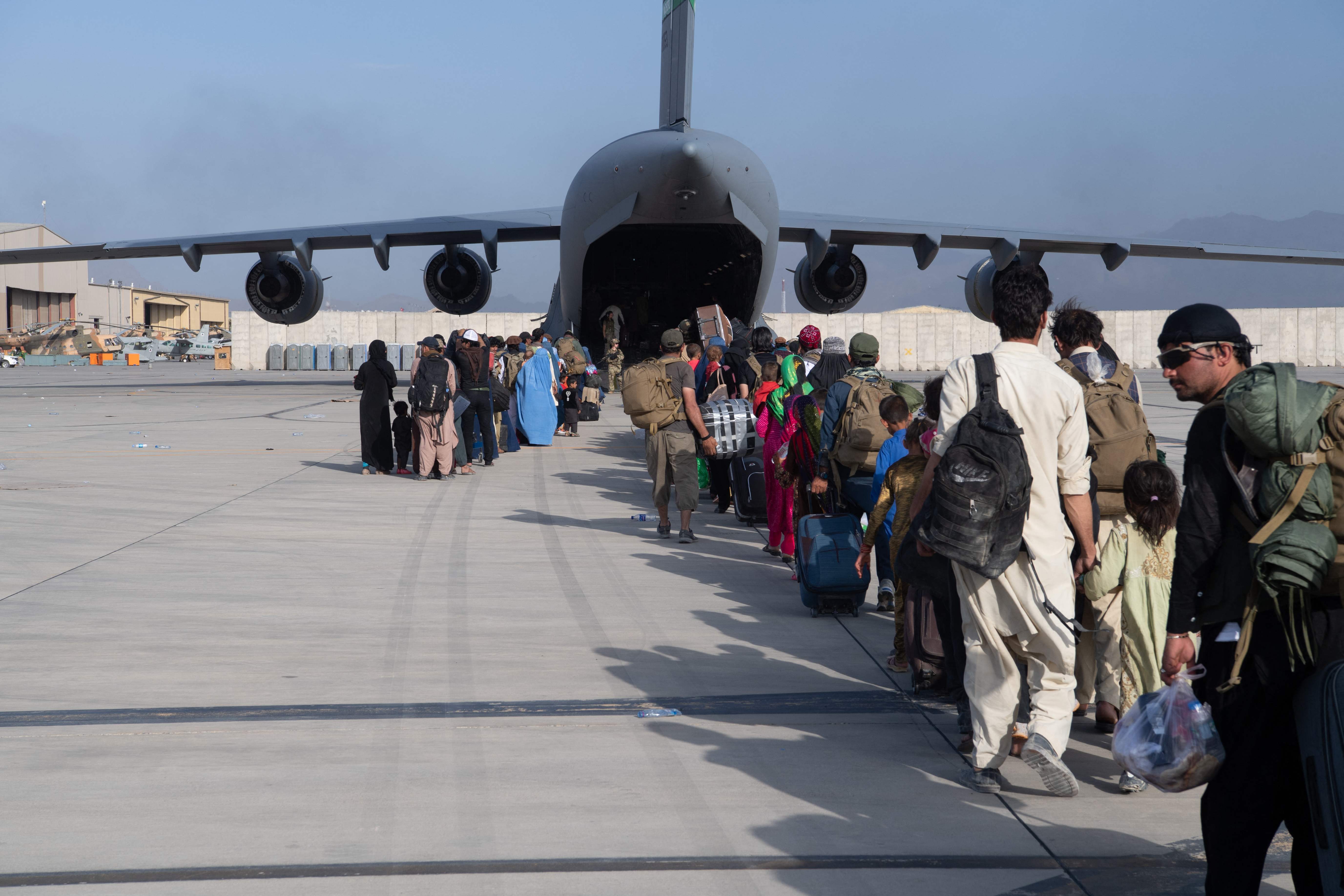 An evacuation flight out of Hamid Karzai International Airport in Kabul overseen by US Air Force personnel