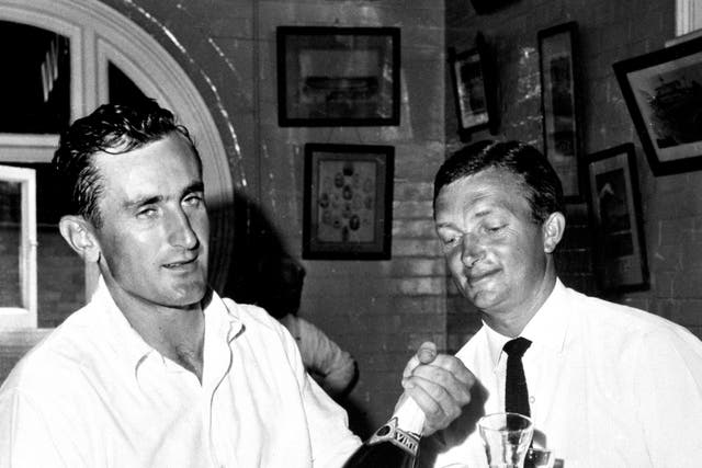 Ted Dexter, left, shares a drink with Australia captain Richie Benaud after an Ashes Test in 1963 (PA)