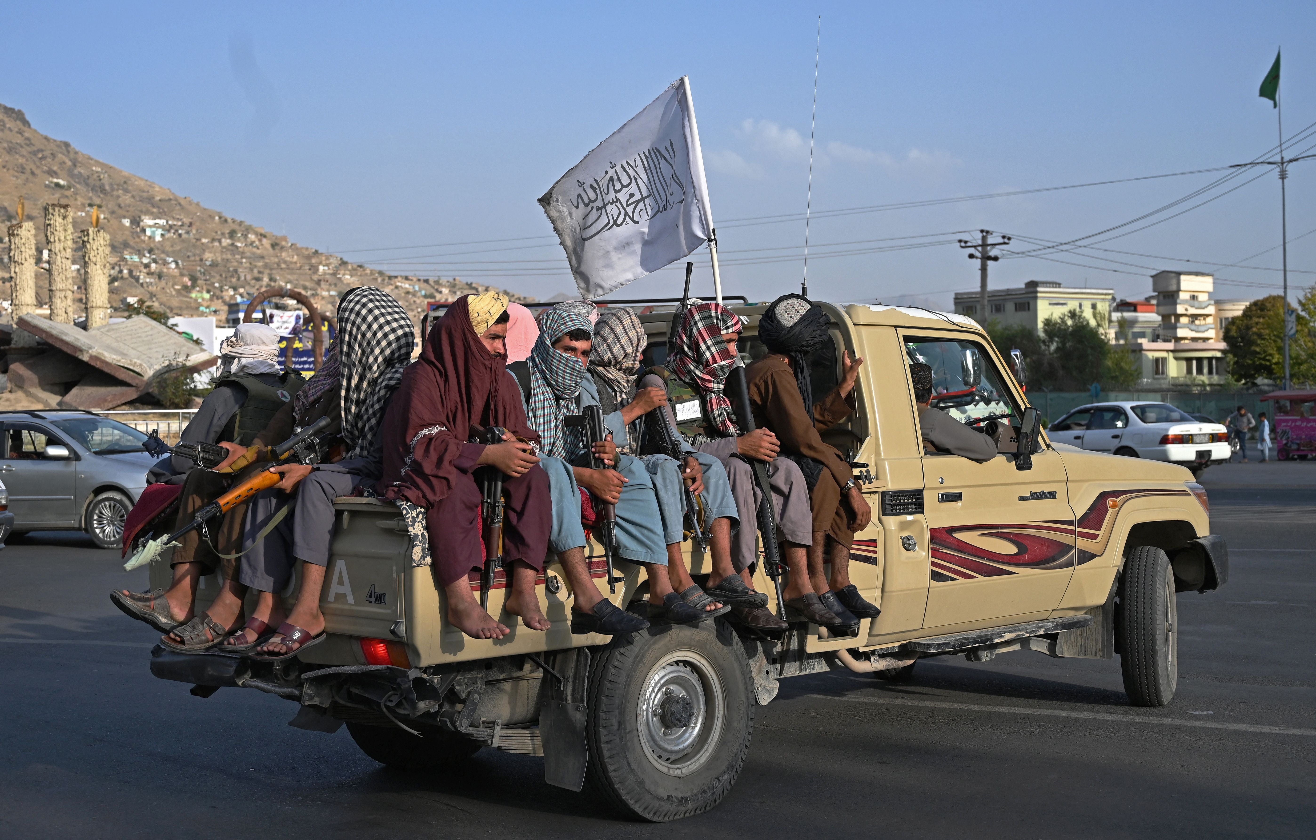 Taliban fighters patrol the streets of Kabul