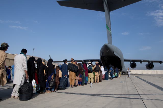 <p>The US Air Force load passengers onto a C-17 Globemaster III at Hamid Karzai International Airport in Kabul, Afghanistan on August 24, 2021</p>