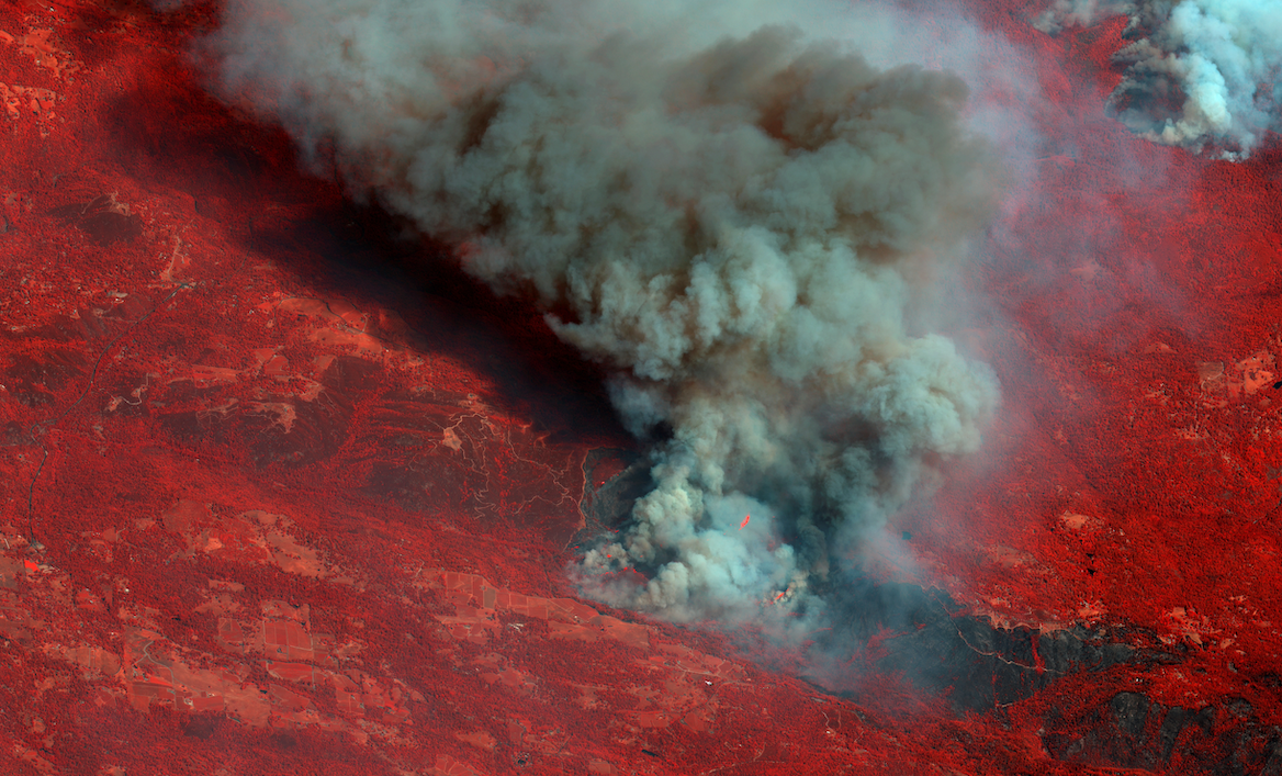 <p>A colour infrared satellite image of smoke billowing from Caldor Fire east of Sacramento, California, 25 August</p>