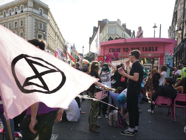 <p>XR protesters block the junction of Long Acre and Upper St Martin’s Lane on 23 August</p>