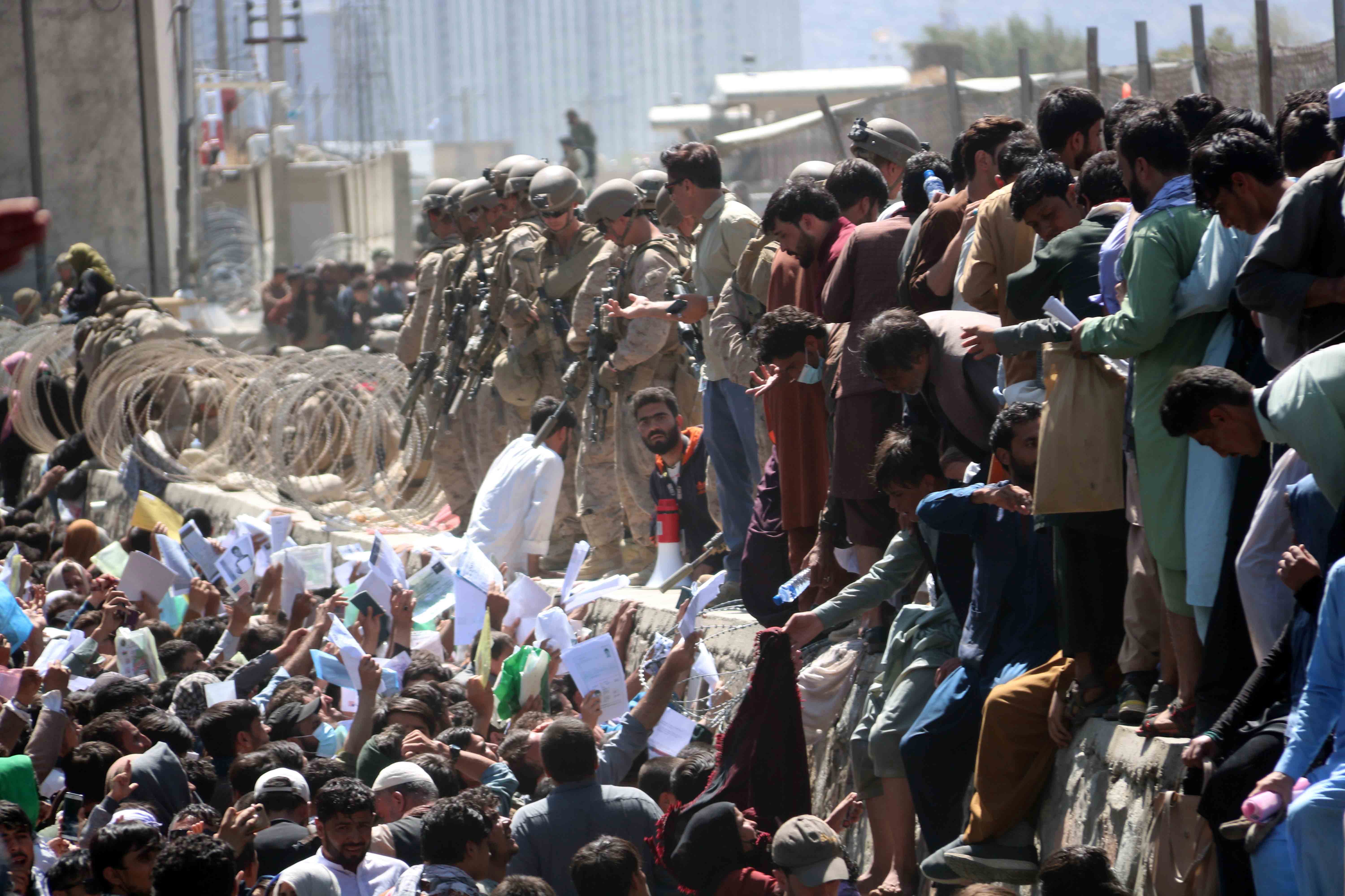 Afghans struggle to gain entry to the Hamid Karzai International Airport in Kabul