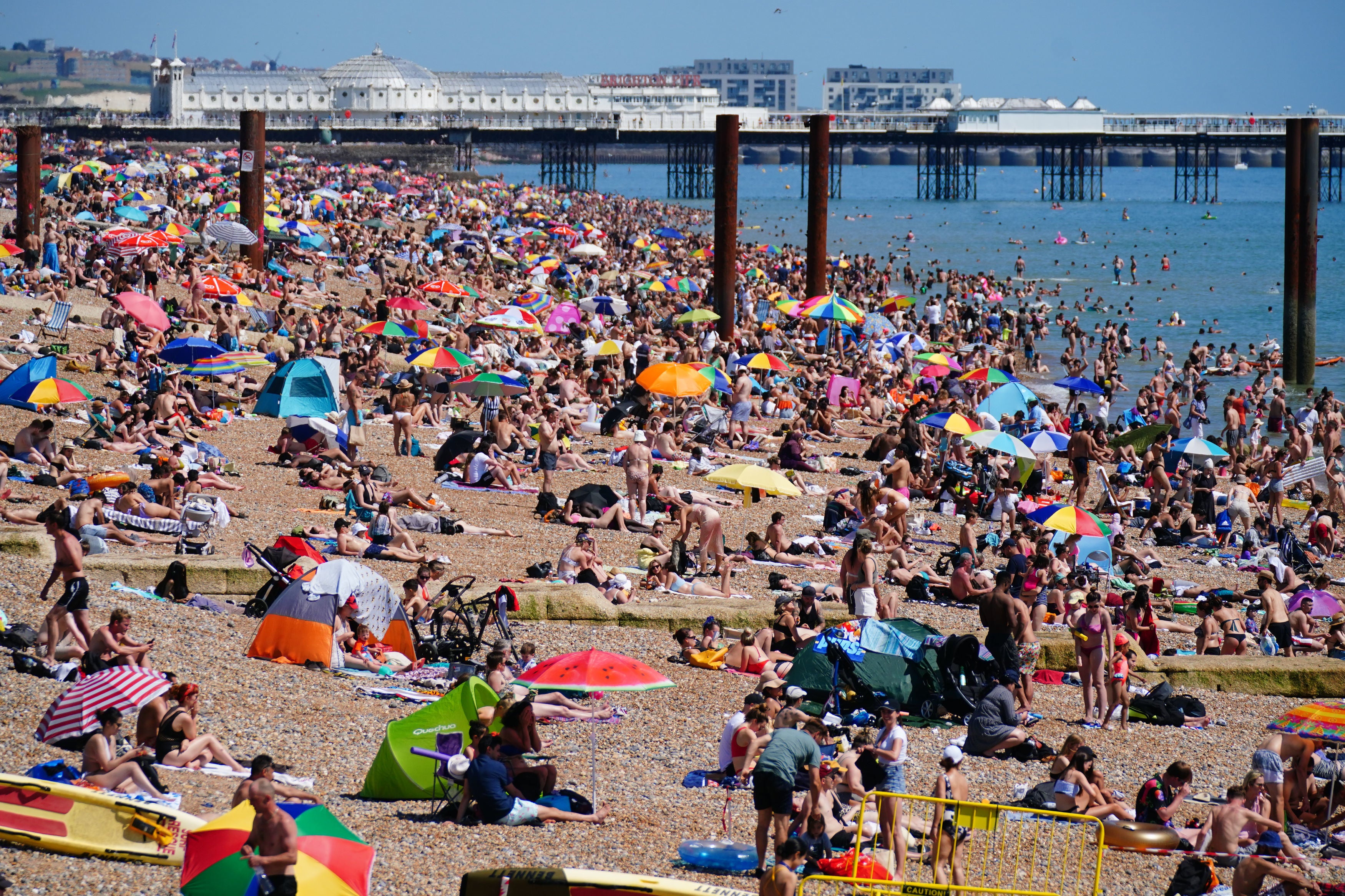 People enjoying the hot weather on Brighton beach in July 2021
