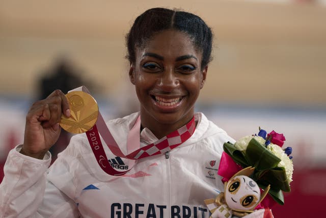 <p>Kadeena Cox celebrates with her gold medal </p>