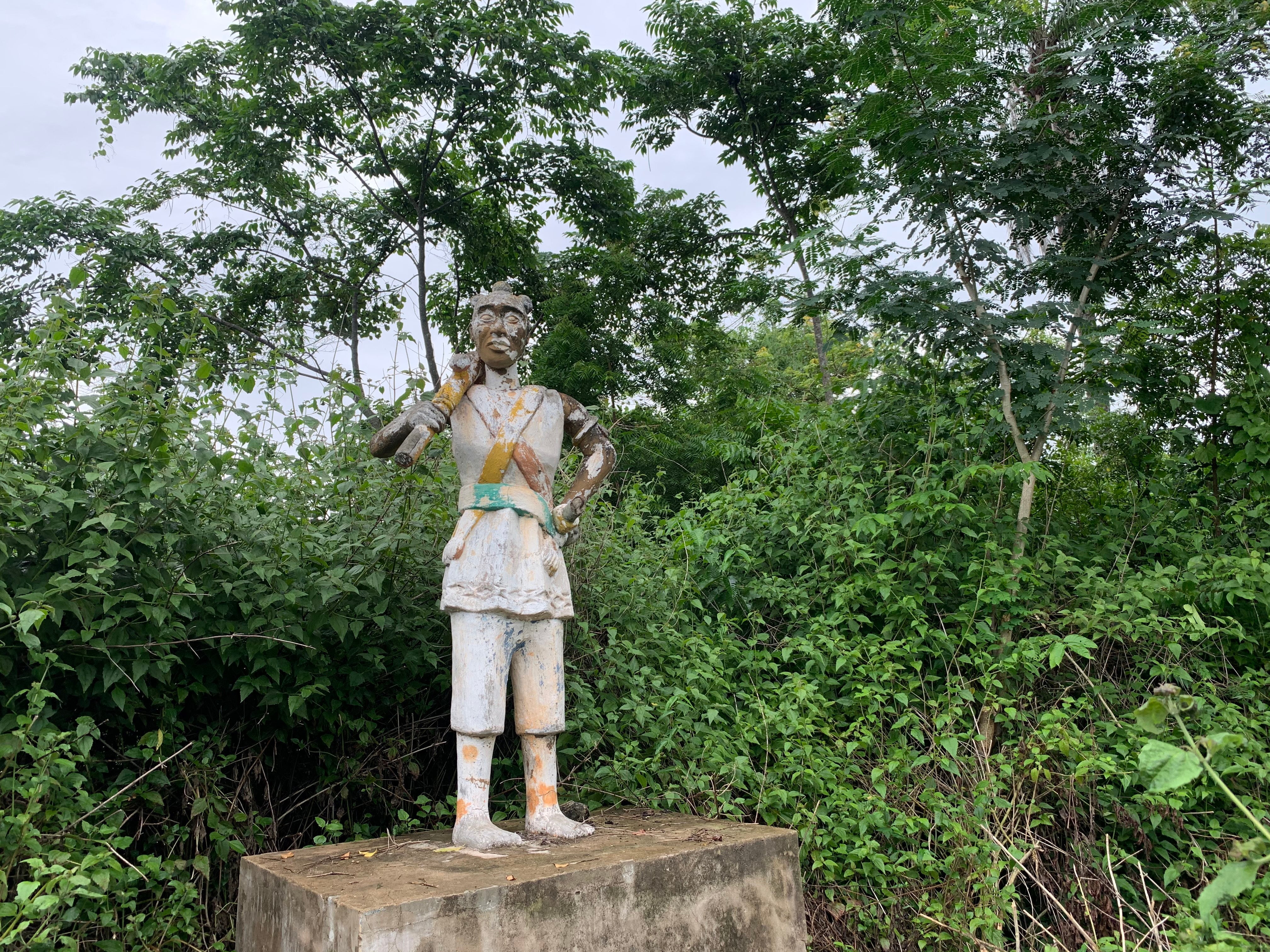 The stone statue of an Amazon in a village near Abomey, Benin