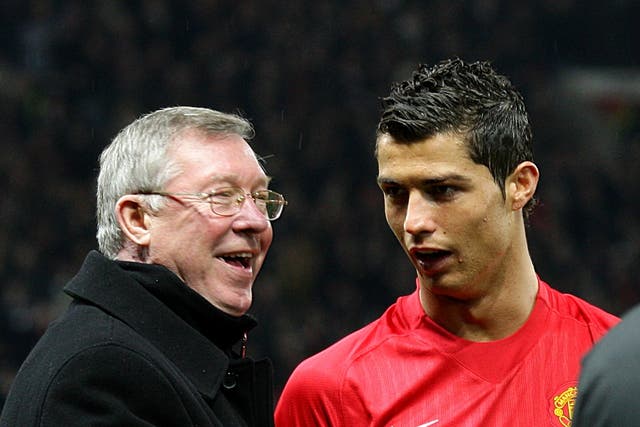 Sir Alex Ferguson, left, spoke to Cristiano Ronaldo about a return to Old Trafford (Martin Rickett/PA)