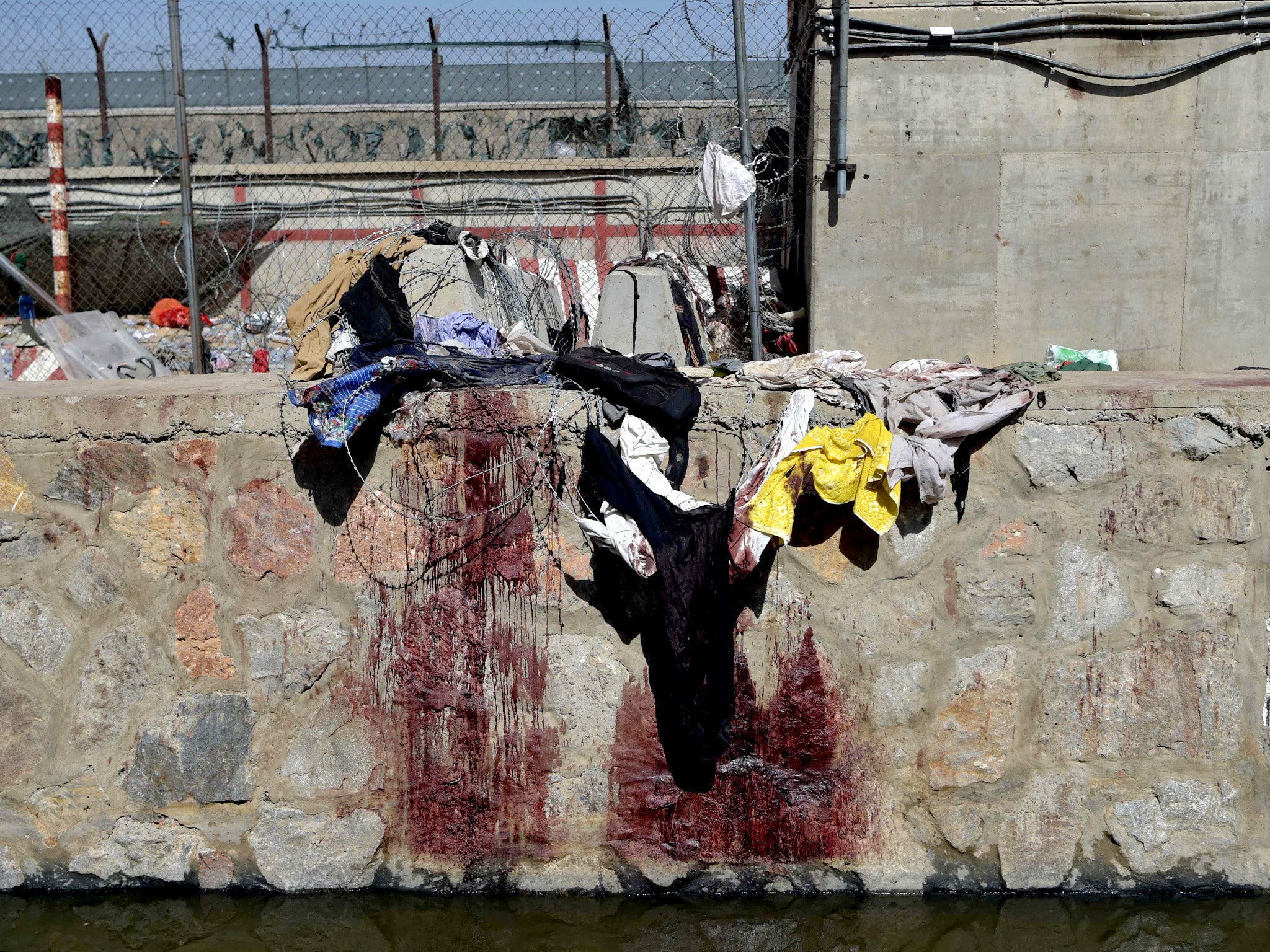 Clothes and blood stains at the site of the suicide bomb attack that killed more than 180 people