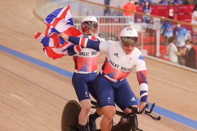 Neil Fachie from Great Britain and his rider Matthew Rotherham (front) are happy about their victory in the Men’s 1000m Time Trial B – Visually Impaired at the Izu Velodrome (PA Wire via DPA)