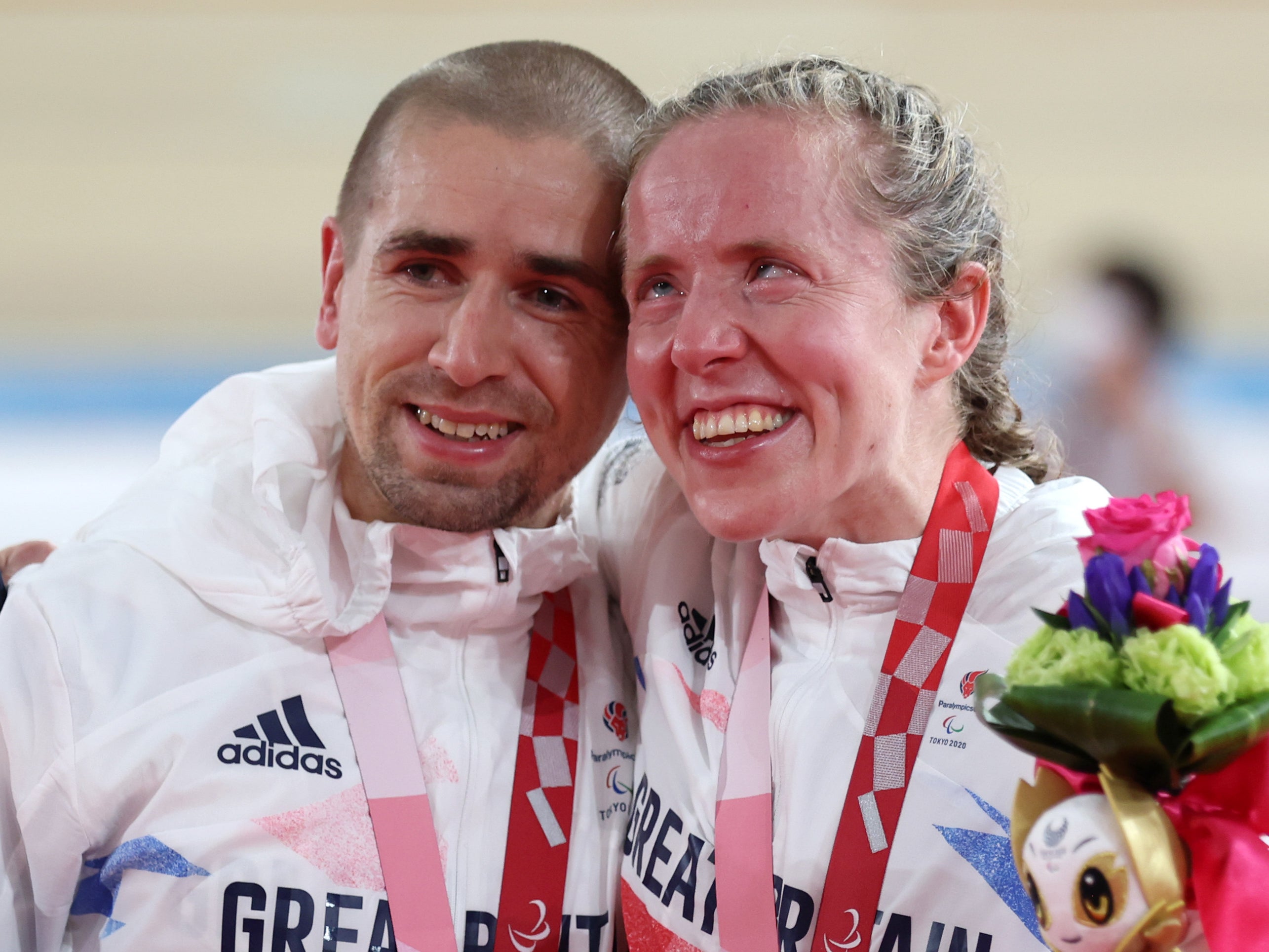 Gold medalists Neil and Lora Fachie celebrate at the Izu Velodrome
