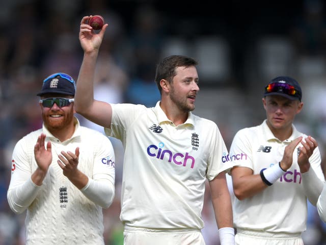 <p>England bowler Ollie Robinson holds aloft the ball after taking his five wickets in the second innings </p>