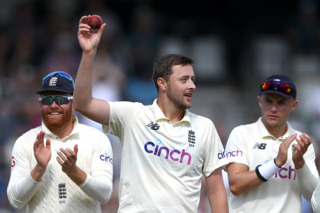 <p>England bowler Ollie Robinson holds aloft the ball after taking his five wickets in the second innings </p>