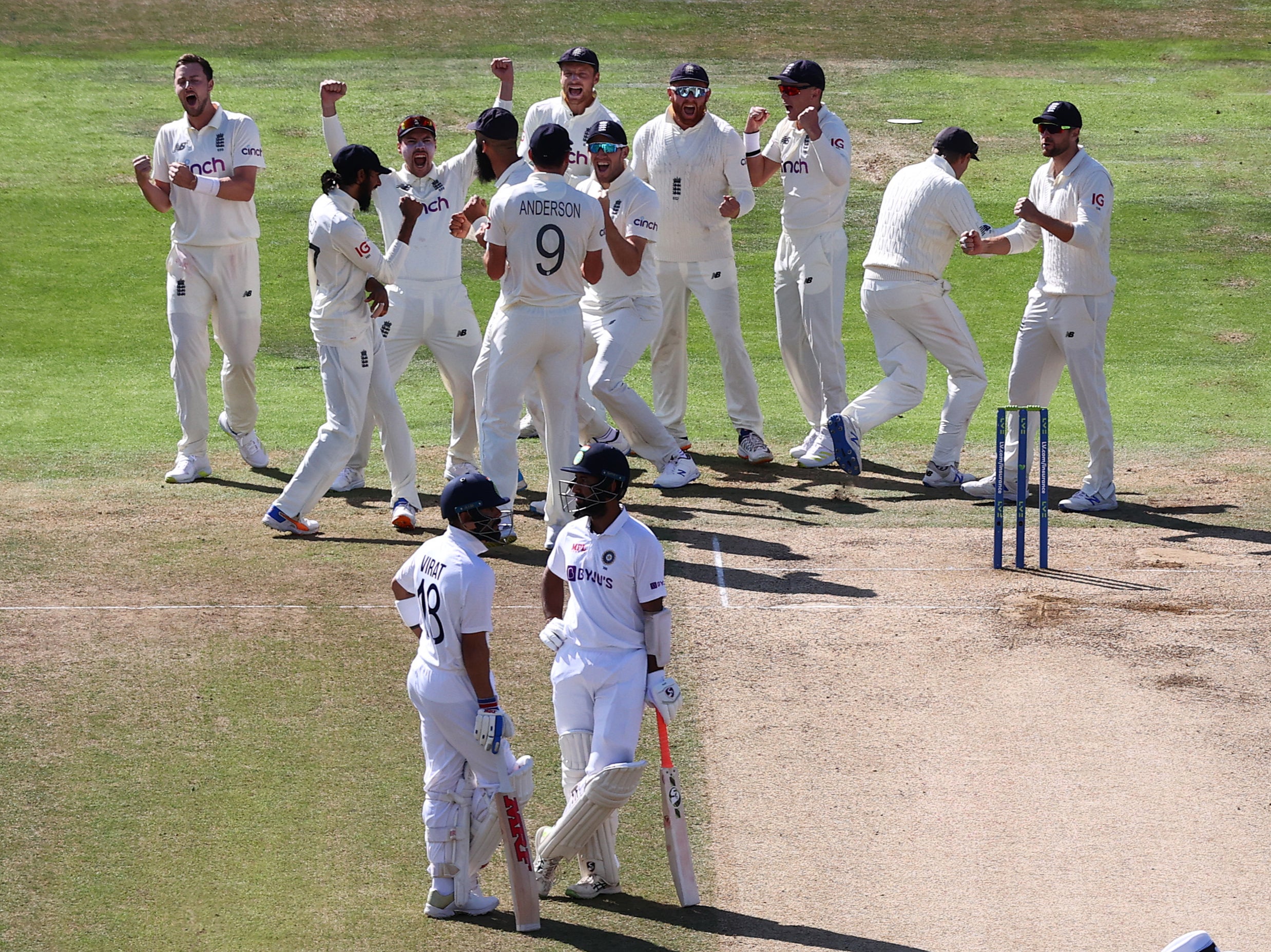 England celebrate the lbw wicket of Cheteshwar Pujara