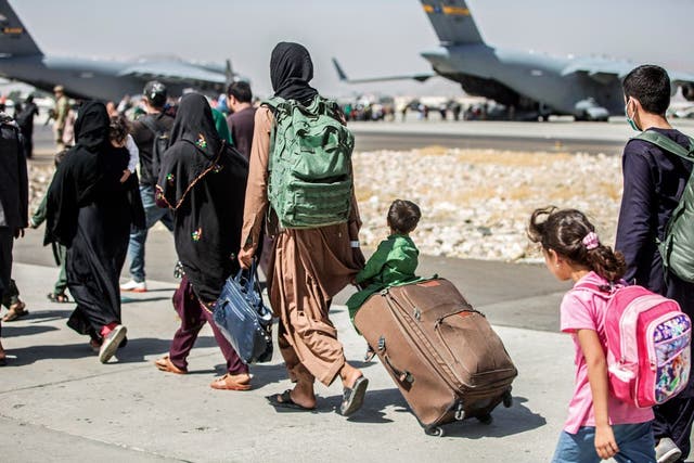 <p>Afghans flee the Taliban at Kabul Airport</p>