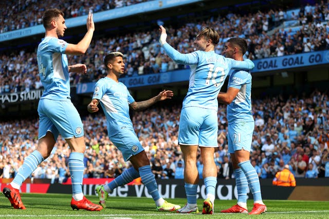 <p>Ferran Torres of Manchester City celebrates with teammates Aymeric Laporte, Joao Cancelo, and Jack Grealish</p>