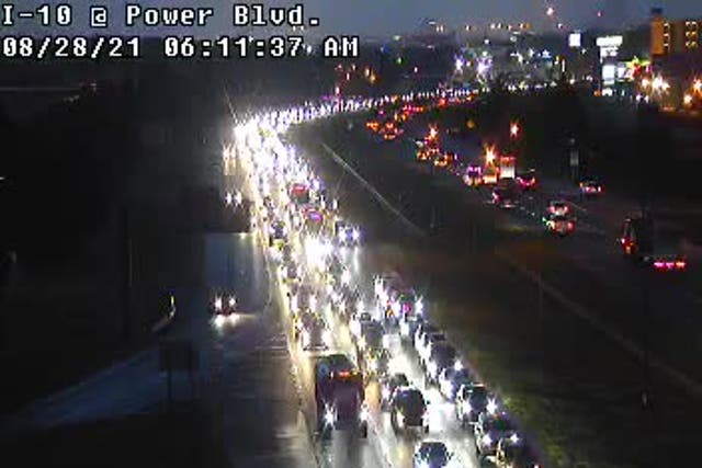 <p>An early-morning traffic jam on I-10 on Saturday 28 August, 2021, as Louisiana residents flee the arrival of Hurricane Ida on Sunday.</p>