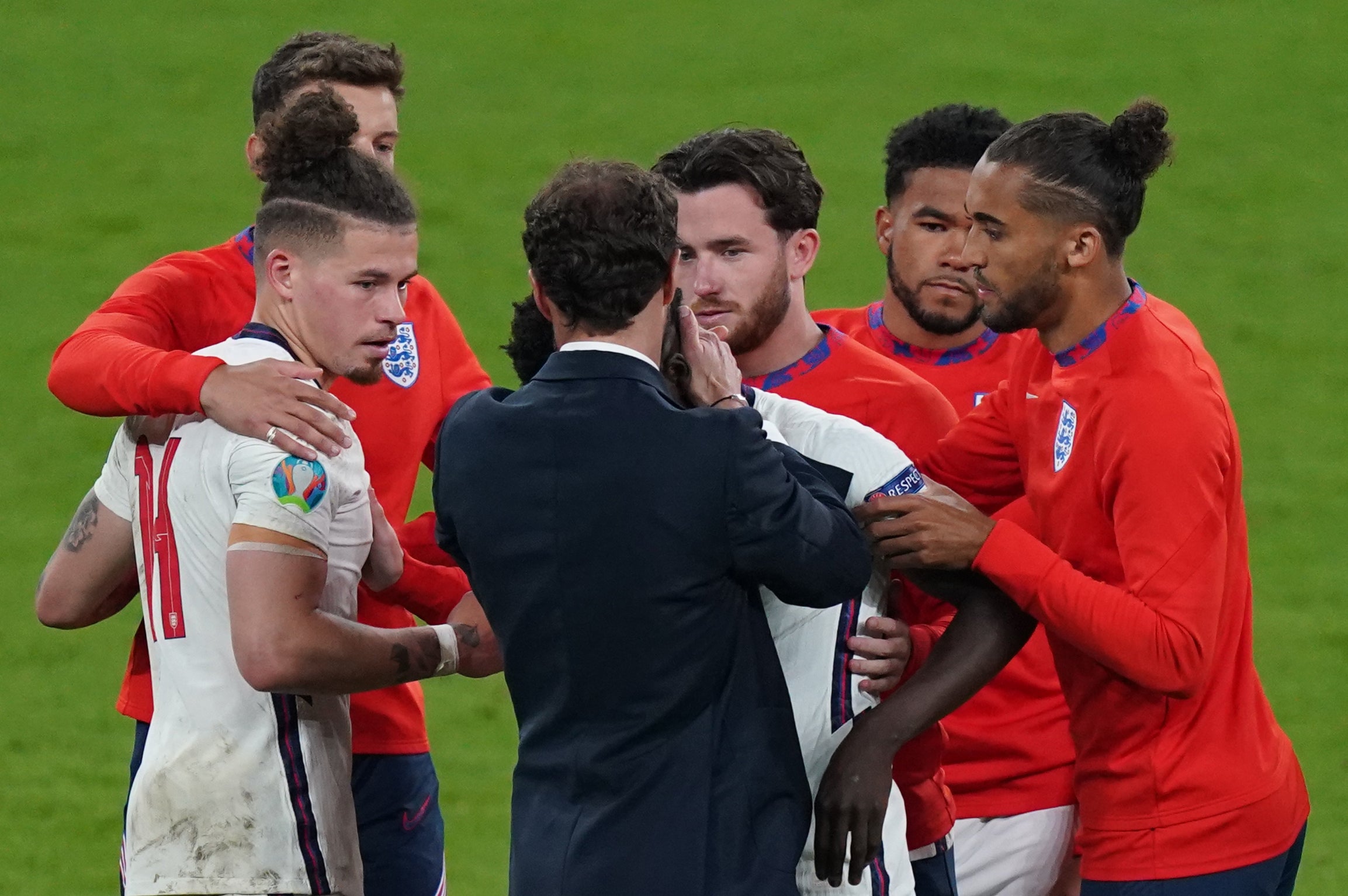 England’s Bukayo Saka is consoled by manager Gareth Southgate after missing during the penalty shoot out against Italy in the Euro 2020 final at Wembley.