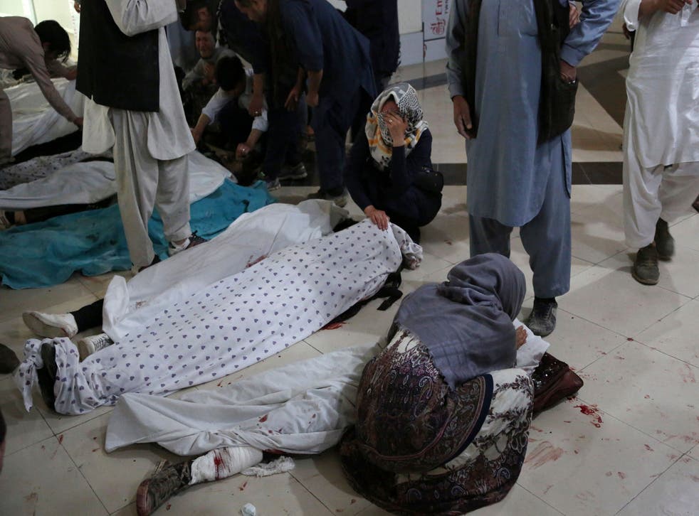 <p>Relatives mourn victims who died in a blast outside a school in the west Kabul district of Dasht-e-Barchi in May</p>