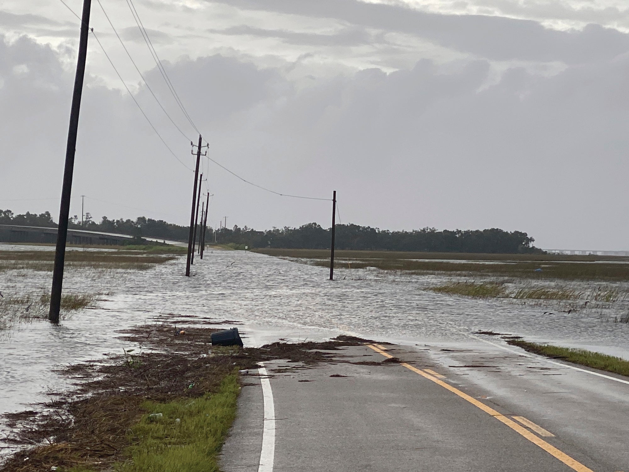 Harrison County W Wittmann Road in Pass Christian, Miss. floods in the early morning of Sunday, Aug. 29, 2021 as a result of the arrival of Hurricane Ida. (Hunter Dawkins/The Gazebo Gazette via AP)