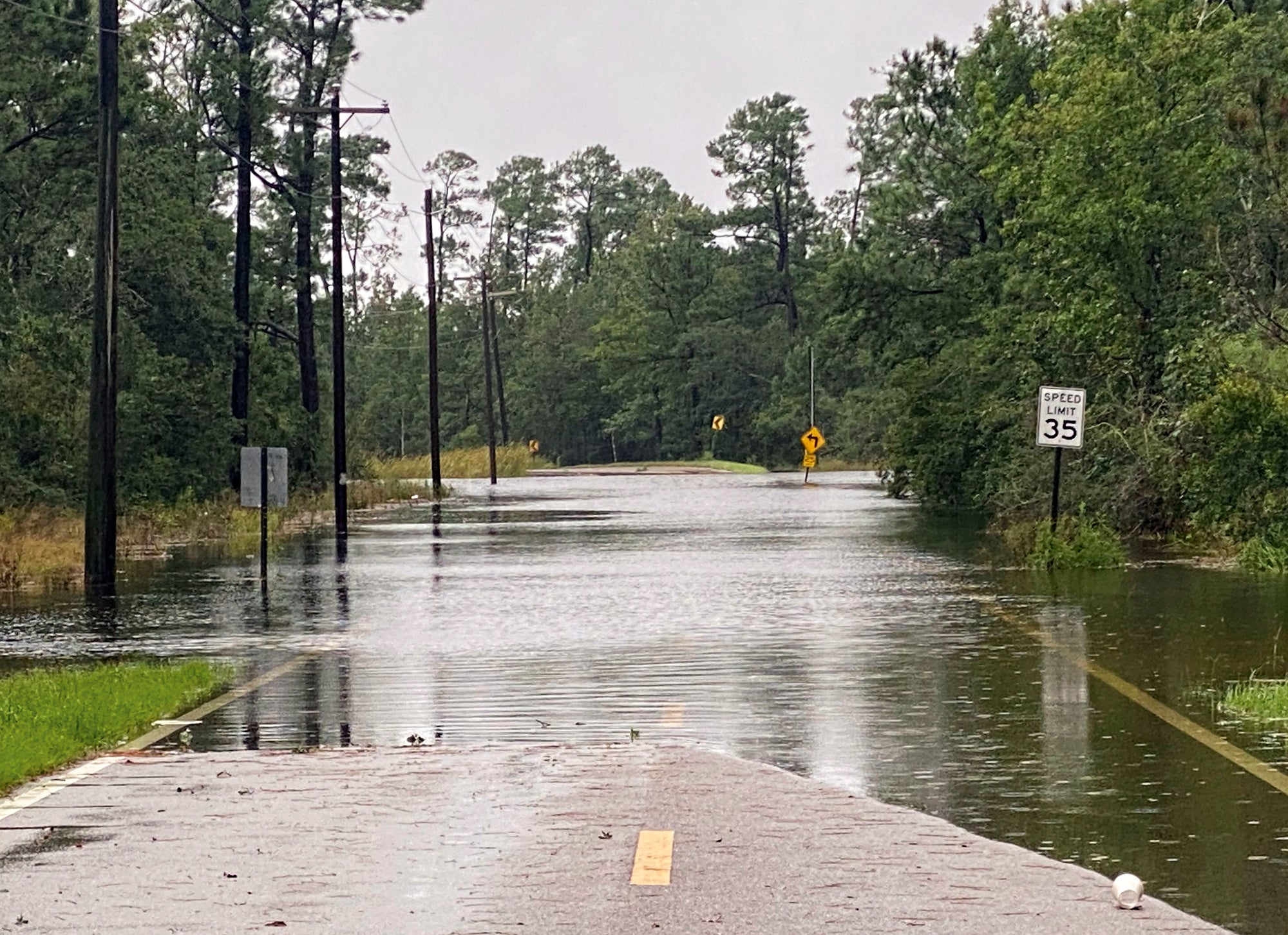 Henderson Avenue in Pass Christian, Miss. completely flooded as a result of the arrival of Hurricane Ida early Sunday, Aug. 29, 2021. (Hunter Dawkins/The Gazebo Gazette via AP)