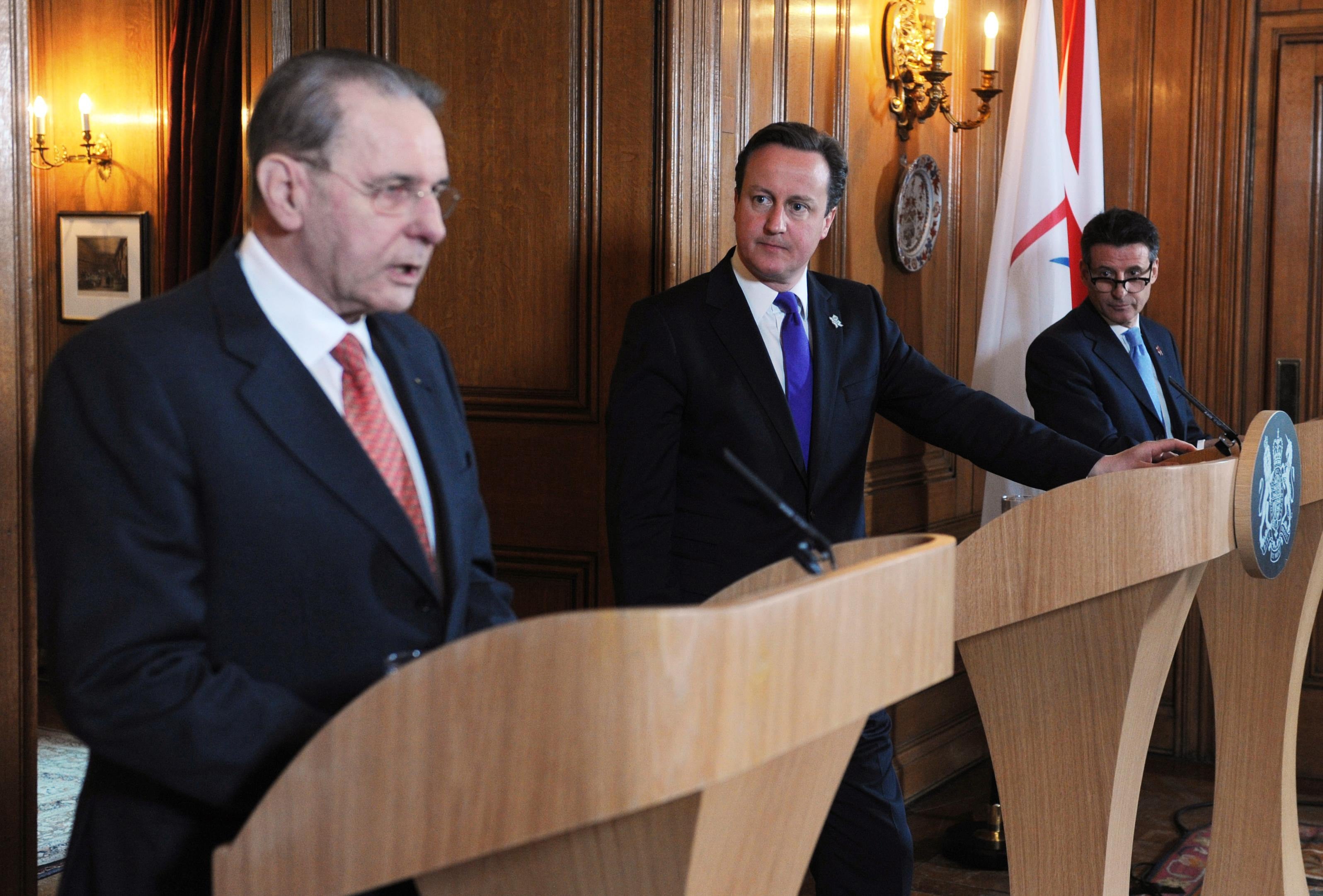 Jacques Rogge alongside David Cameron and Lord Coe ahead of London 2012 (Stefan Rousseau/PA)