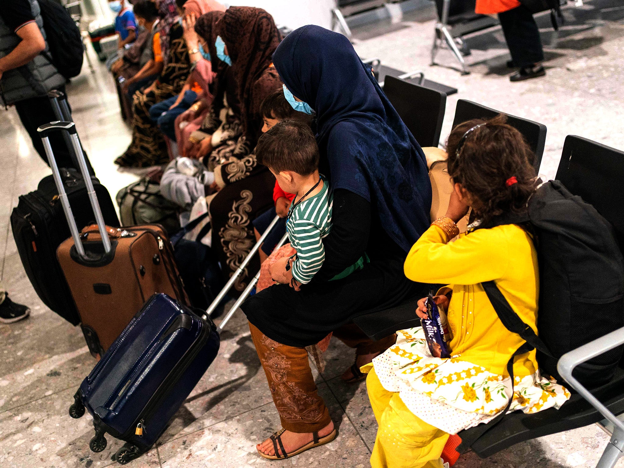 Afghan refugees wait to be processed after arriving on an evacuation flight from Afghanistan, at Heathrow airport in August 2021