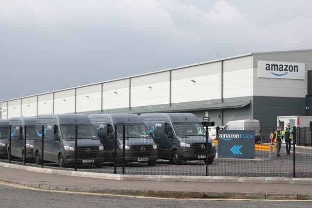 Electric delivery vans at the Amazon warehouse in the Titanic Quarter, Belfas (Niall Carson/PA)