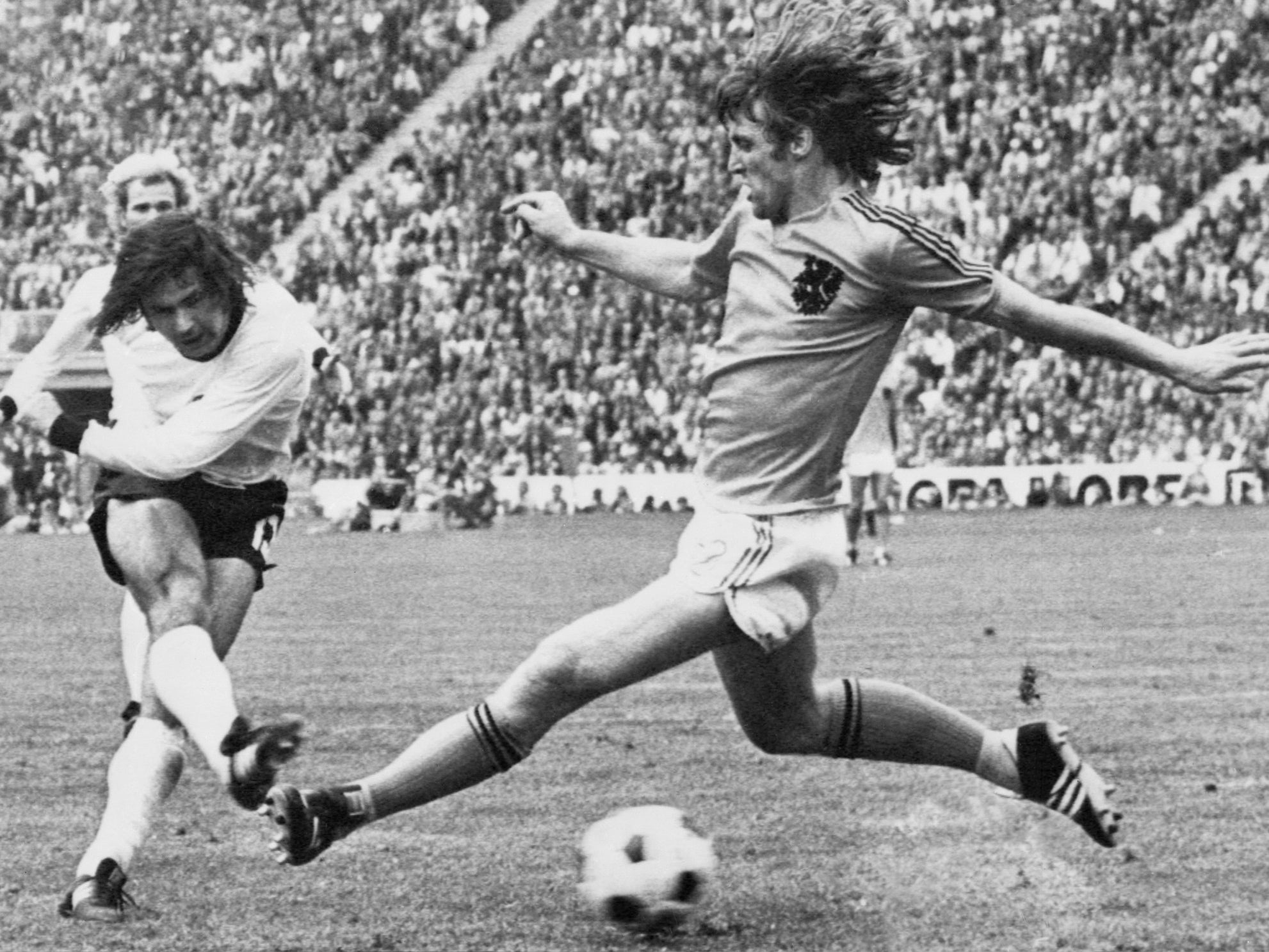 Muller shoots through the legs of the Netherlands’ Rudi Krol to make it 2-1 in the 1974 final in Munich