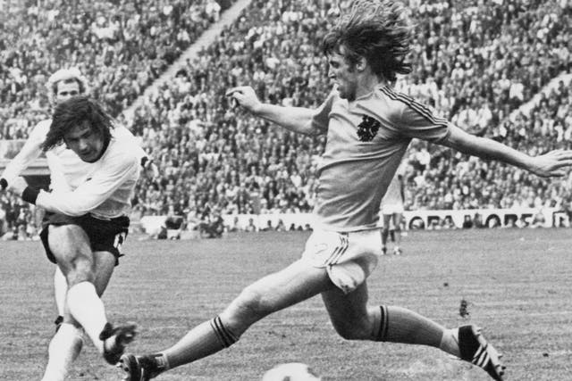 <p>Muller shoots through the legs of the Netherlands’ Rudi Krol to make it 2-1 in the 1974 final in Munich </p>