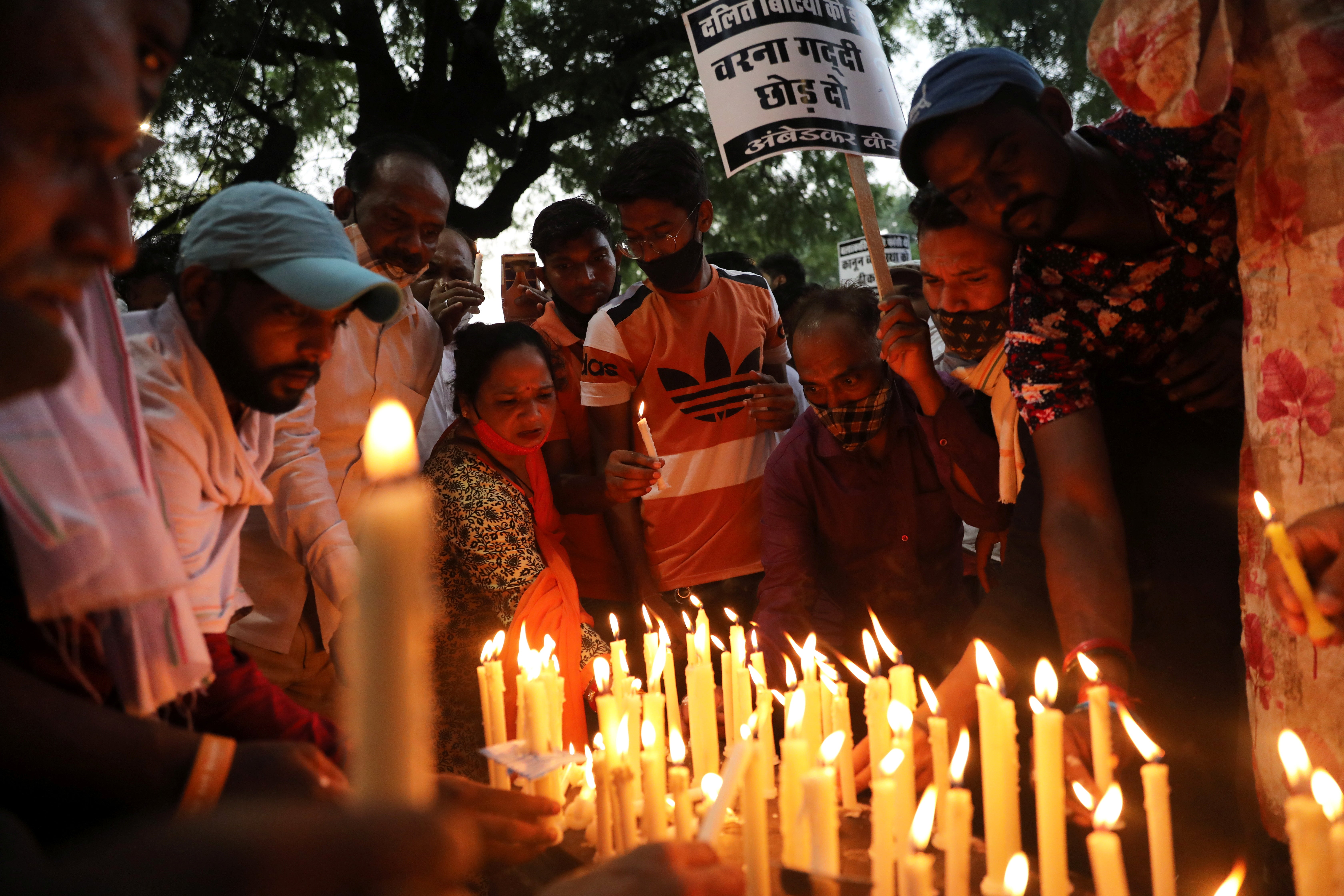 People attend a candlelight vigil to protest against the alleged rape and murder of a 9-year-old girl in New Delhi, India