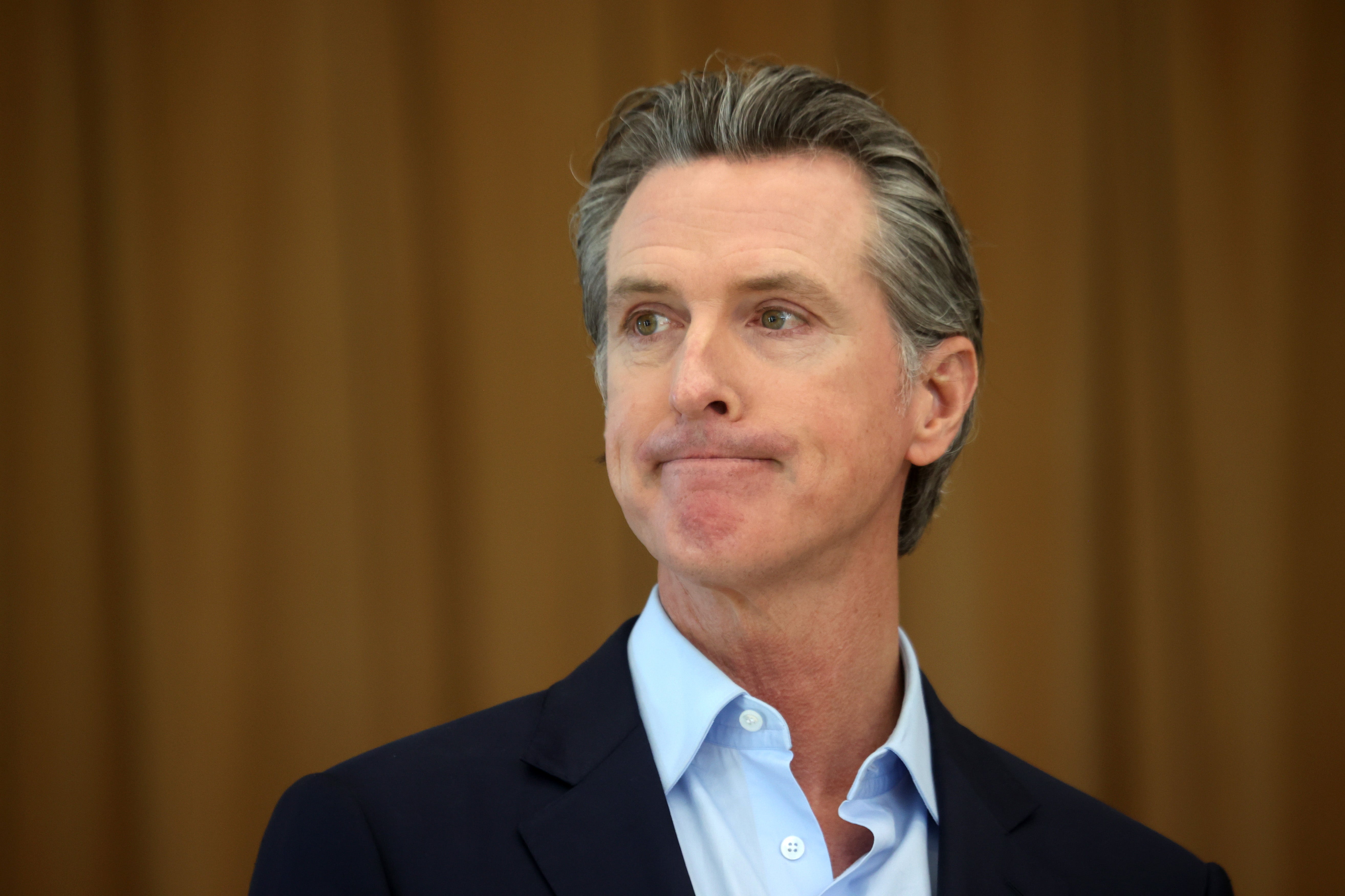 California Gov. Gavin Newsom looks on during a news conference after he toured the newly reopened Ruby Bridges Elementary School on March 16, 2021 in Alameda, California.