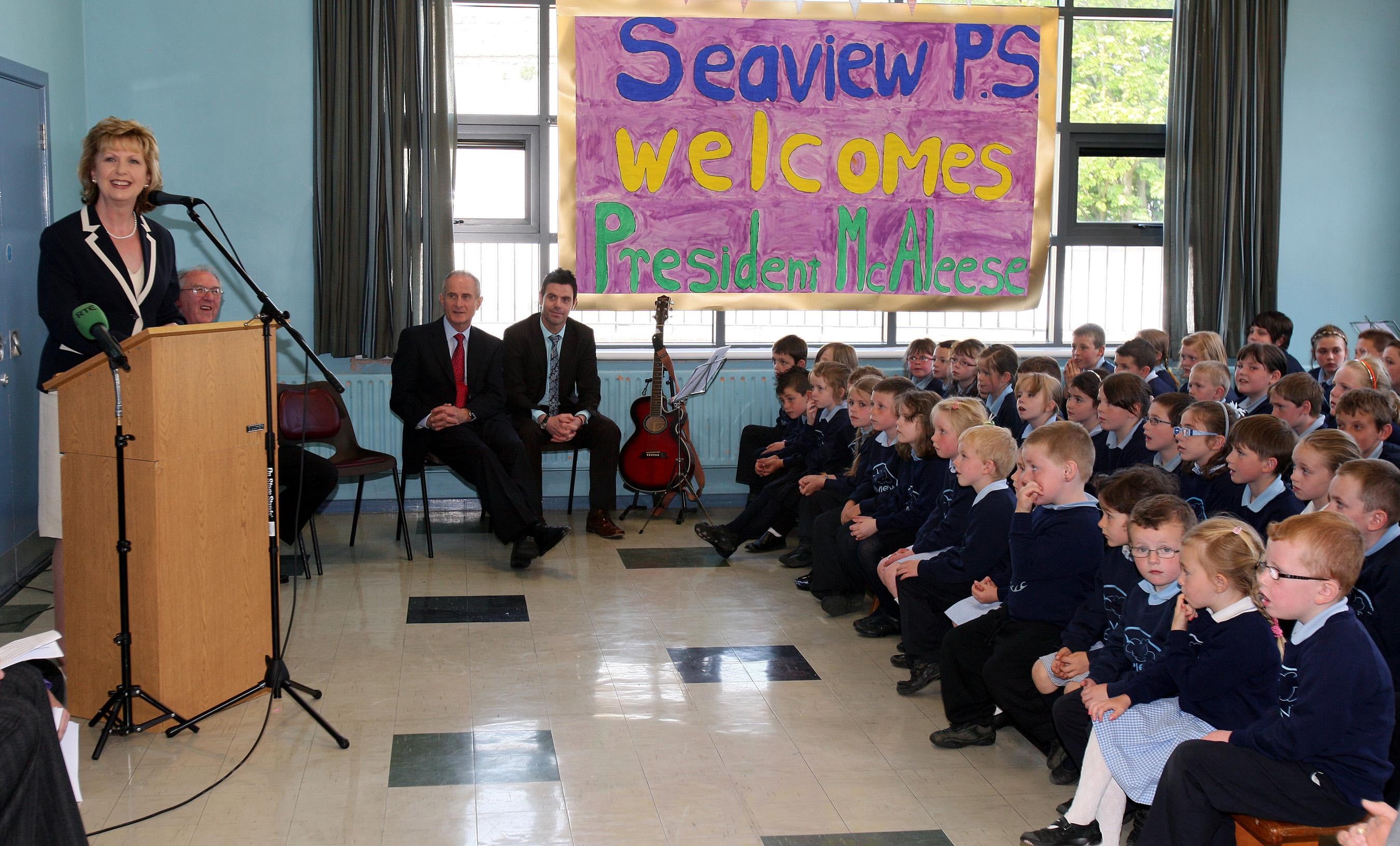 Former Irish president Mary McAleese speaks to pupils at Seaview primary school in Glenarm, Co Antrim