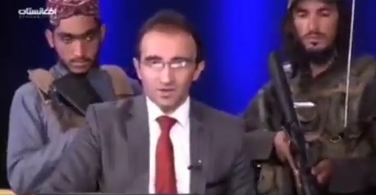 Afghanistan TV anchor reads headlines while surrounded by gun-toting Taliban | The Independent