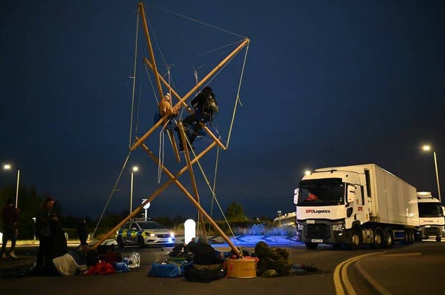 <p>Animal Rebellion protesters set up camp outside Arla’s factory in Aylesbury </p>