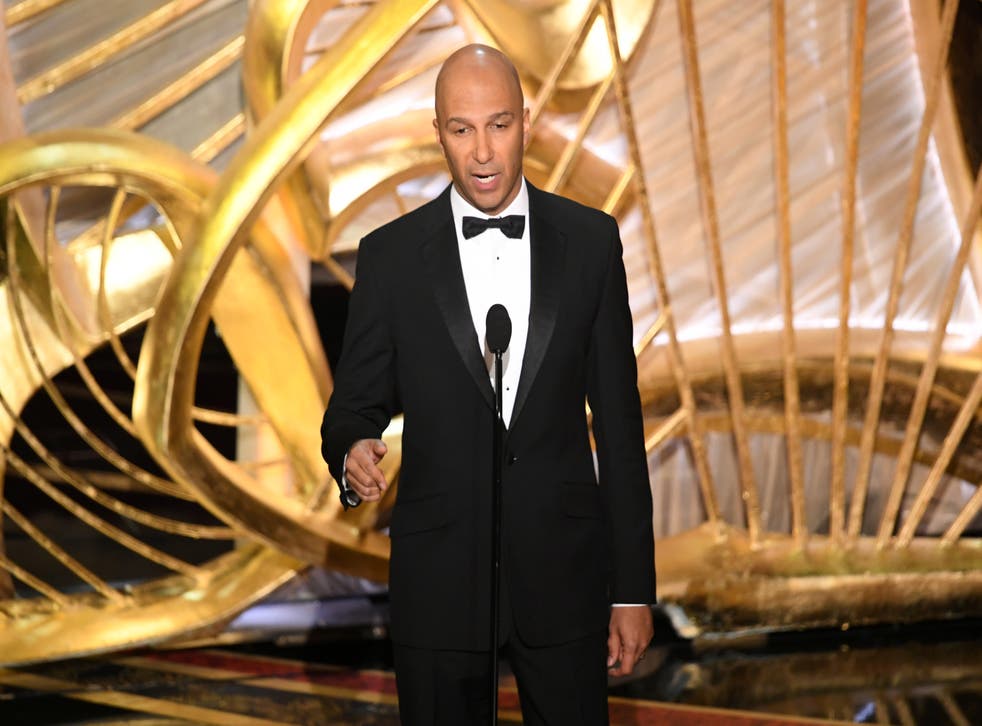 <p>Tom Morello speaks onstage during the 91st Annual Academy Awards in 2019</p>