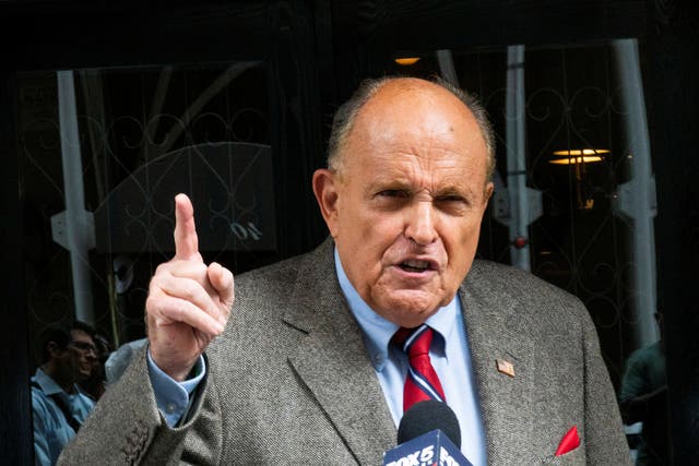 <p>Former New York City Mayor Rudy Giuliani speaks to media about the U.S. evacuation of Afghanistan outside his apartment building in New York City, U.S., August 20, 2021</p>