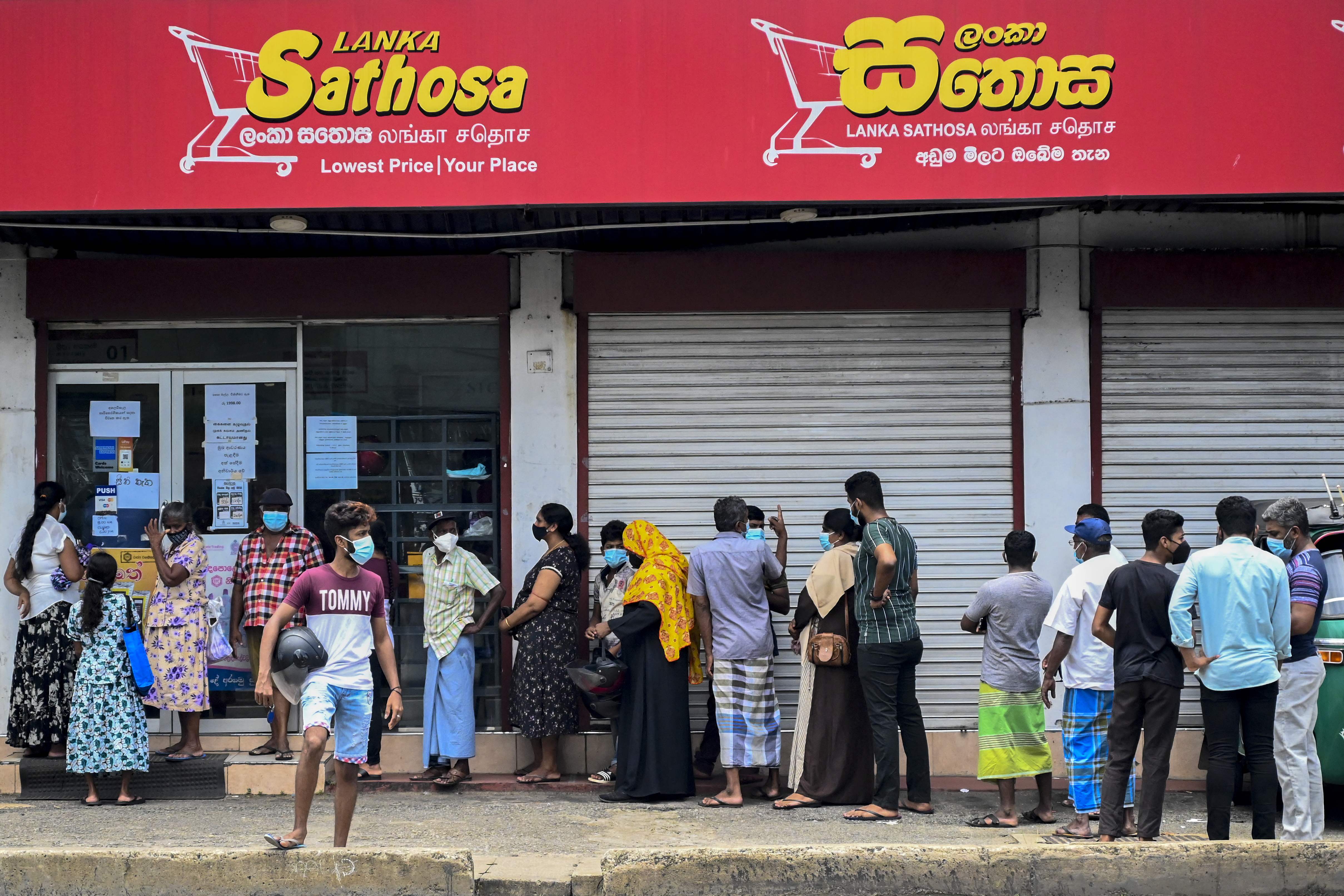 File: People line up outside a supermarket in Colombo, Sri Lanka.