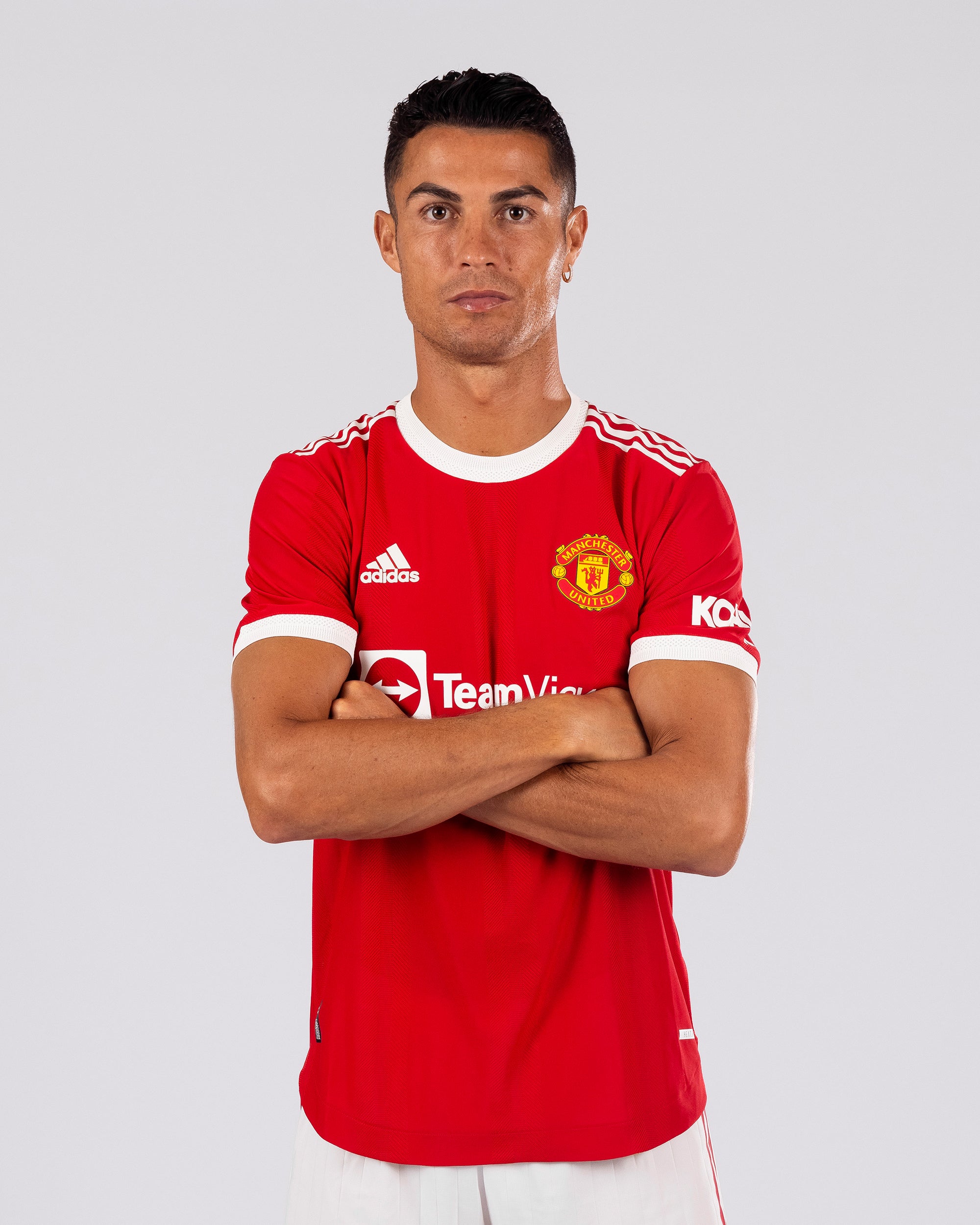 Cristiano Ronaldo of Manchester United poses after signing for the club