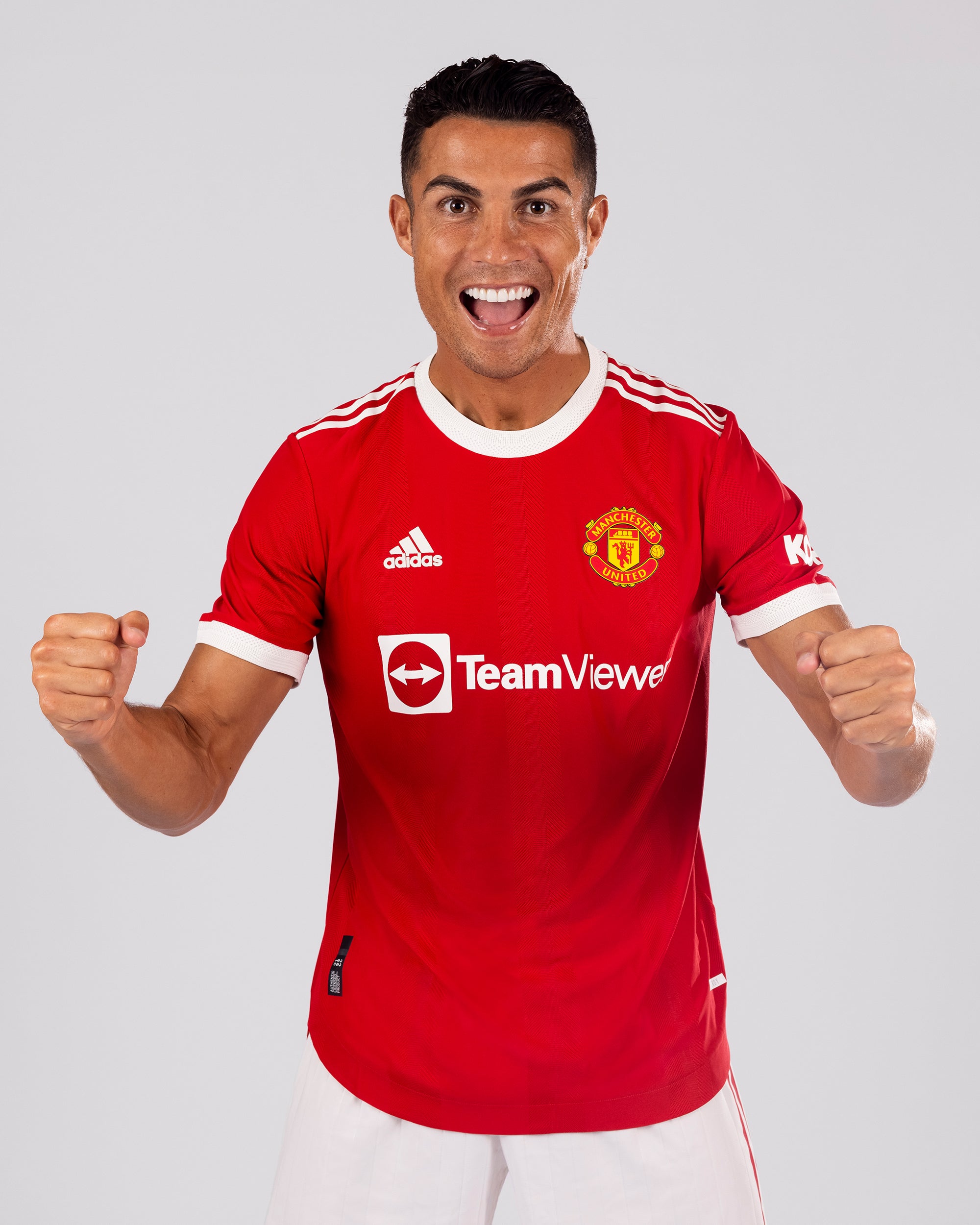 Cristiano Ronaldo of Manchester United poses after signing for the club