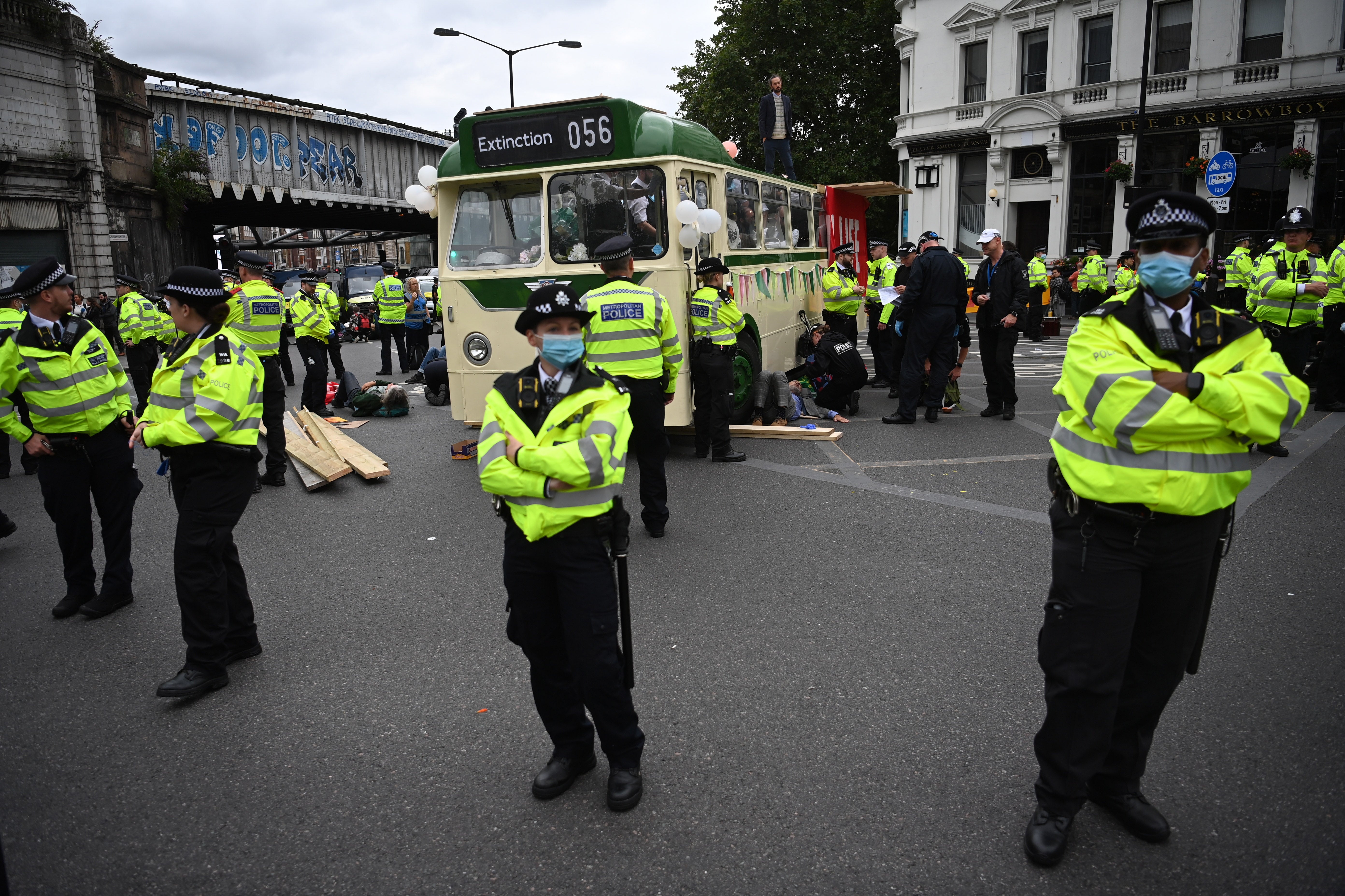 Extinction Rebellion protesters use a bus to block London Bridge