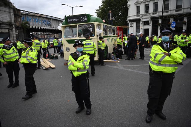 <p>Extinction Rebellion protesters use a bus to block London Bridge</p>
