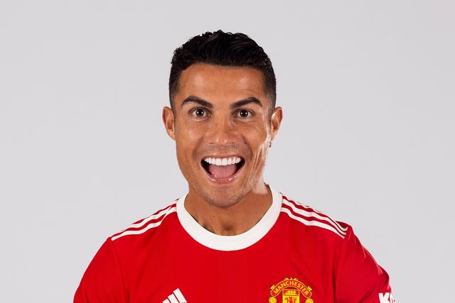 <p>Cristiano Ronaldo of Manchester United poses after signing for the club</p>