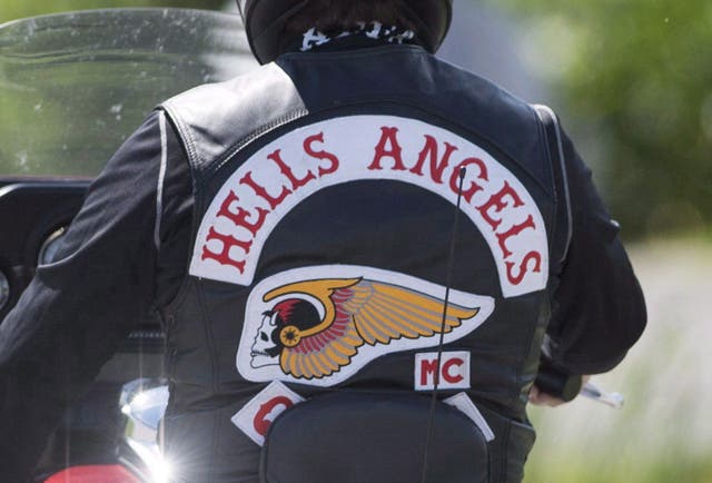 <p>A member of the Hells Angels arrives for a national gathering in Saint-Charles-sur-Richelieu, Que., on August 10, 2018.</p>