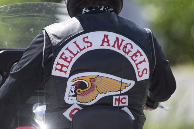 <p>A member of the Hells Angels arrives for a national gathering in Saint-Charles-sur-Richelieu, Que., on August 10, 2018.</p>