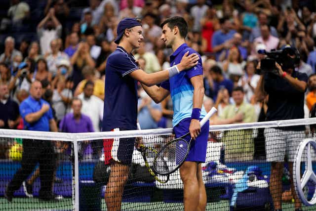 Novak Djokovic commiserates with Holger Rune (Frank Franklin II/AP)