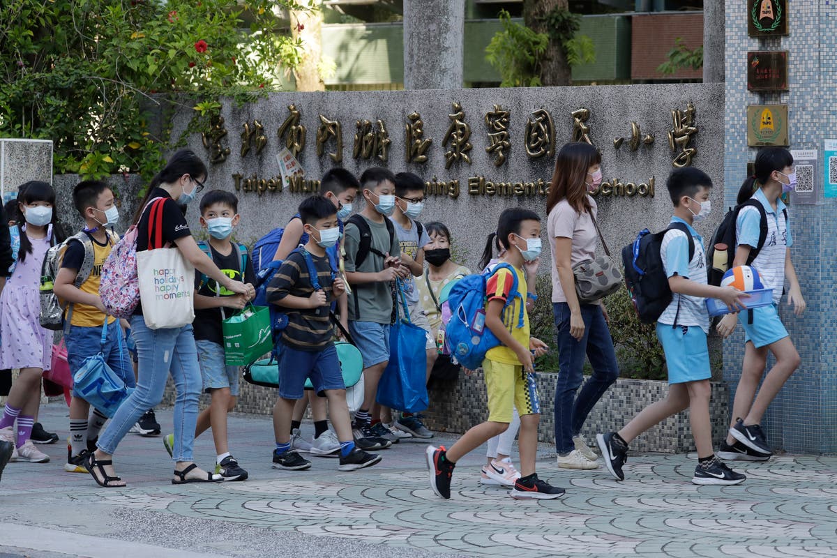 The Latest: Taiwan schools open with masks, plastic dividers | The ...